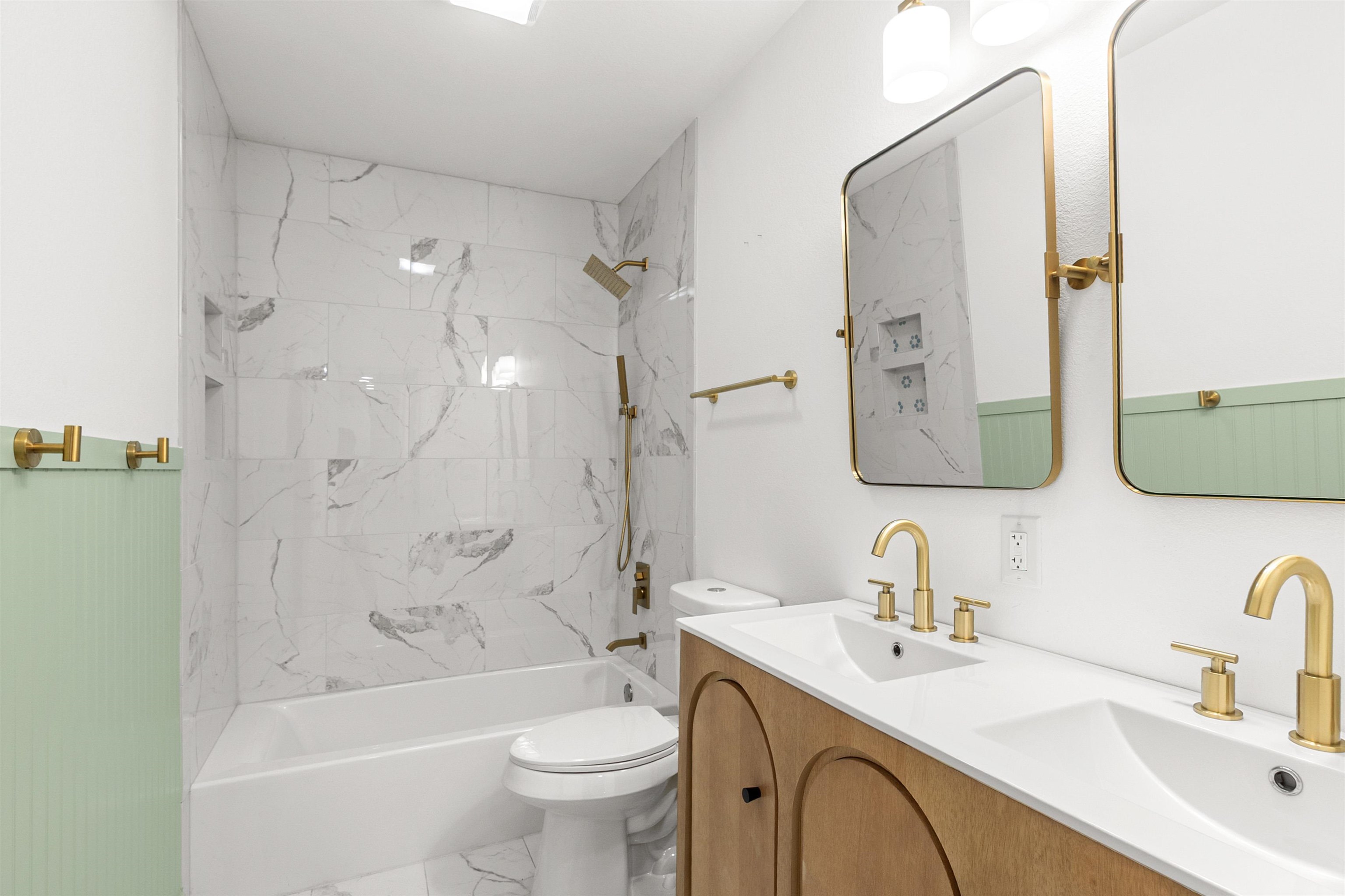 409 Ave R Marble Falls, TX 78654 - Photo 17 of 20 a bathroom with a bathtub shower sink mirror vanity and toilet