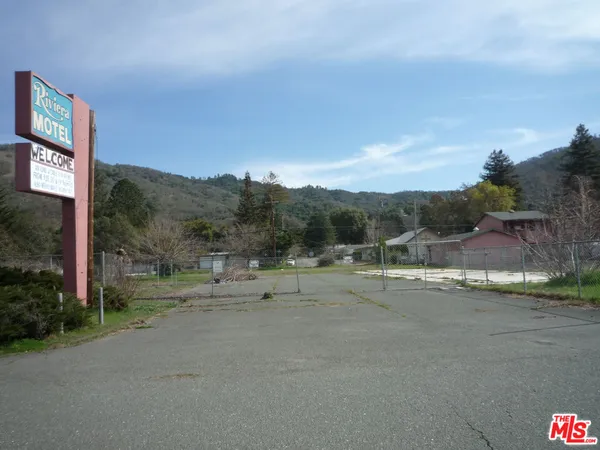 a view of a road with a yard