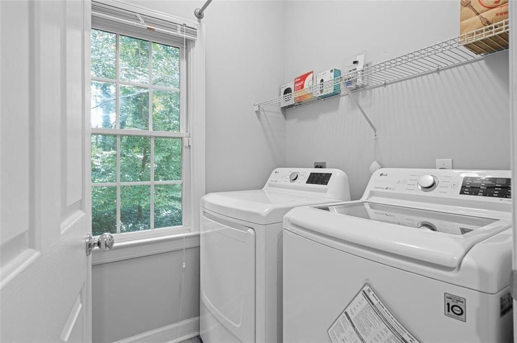 2313 Manor Avenue Atlanta, GA 30344 - Photo 13 of 31 a utility room with dryer and washer