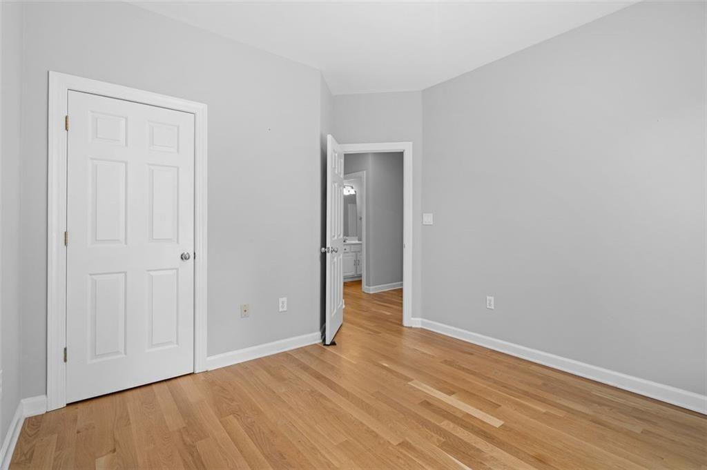 2313 Manor Avenue Atlanta, GA 30344 - Photo 17 of 31 a view of an empty room with wooden floor
