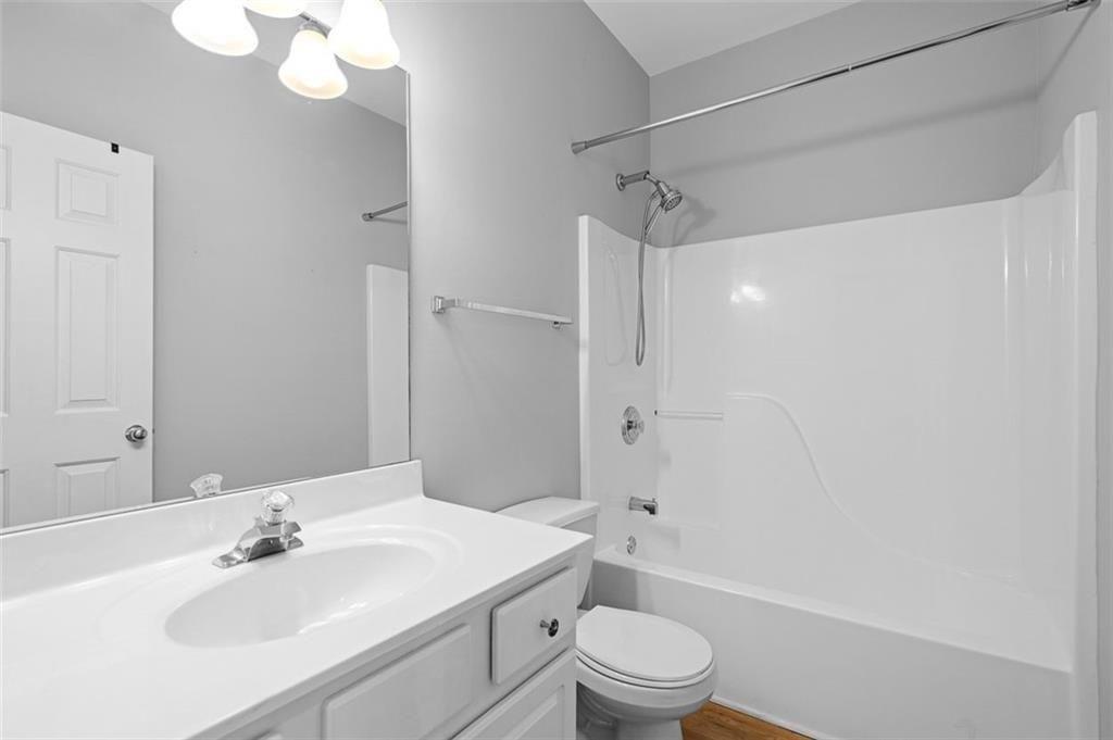 2313 Manor Avenue Atlanta, GA 30344 - Photo 18 of 31 a bathroom with a sink a toilet and shower
