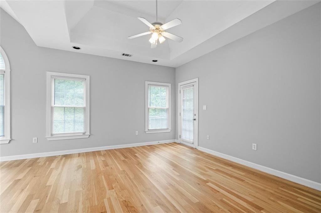 2313 Manor Avenue Atlanta, GA 30344 - Photo 19 of 31 wooden floor in an empty room with a window