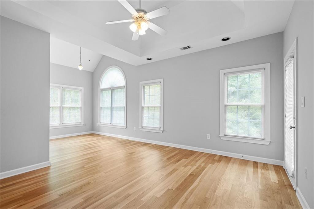 2313 Manor Avenue Atlanta, GA 30344 - Photo 20 of 31 a view of an empty room with a window and wooden floor