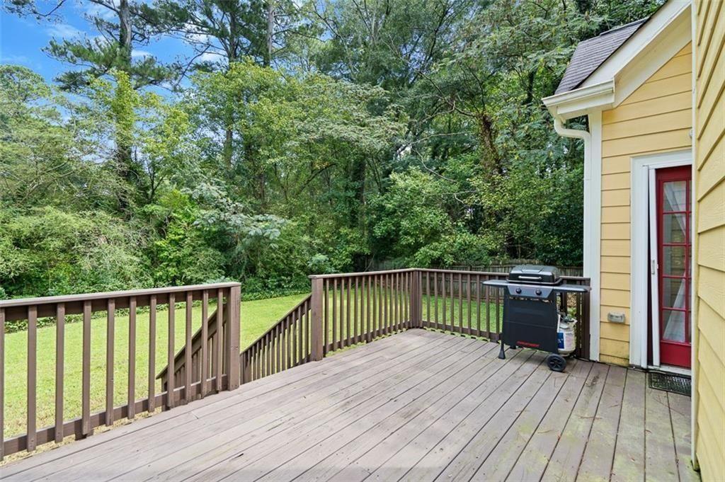 2313 Manor Avenue Atlanta, GA 30344 - Photo 27 of 31 a view of balcony with wooden floor and fence