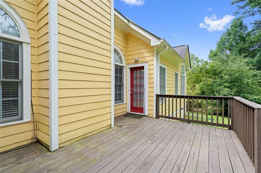 2313 Manor Avenue Atlanta, GA 30344 - Photo 28 of 31 a view of a balcony with wooden floor and fence