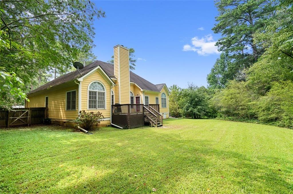 2313 Manor Avenue Atlanta, GA 30344 - Photo 31 of 31 a view of a house with a yard and sitting area