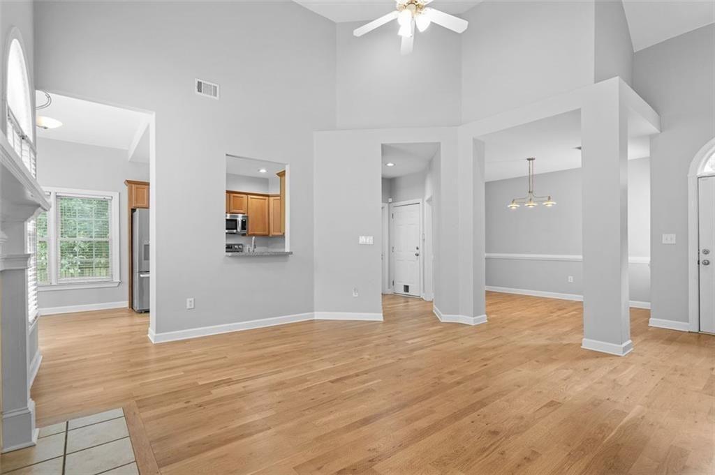 2313 Manor Avenue Atlanta, GA 30344 - Photo 4 of 31 a view of an empty room with wooden floor and a window