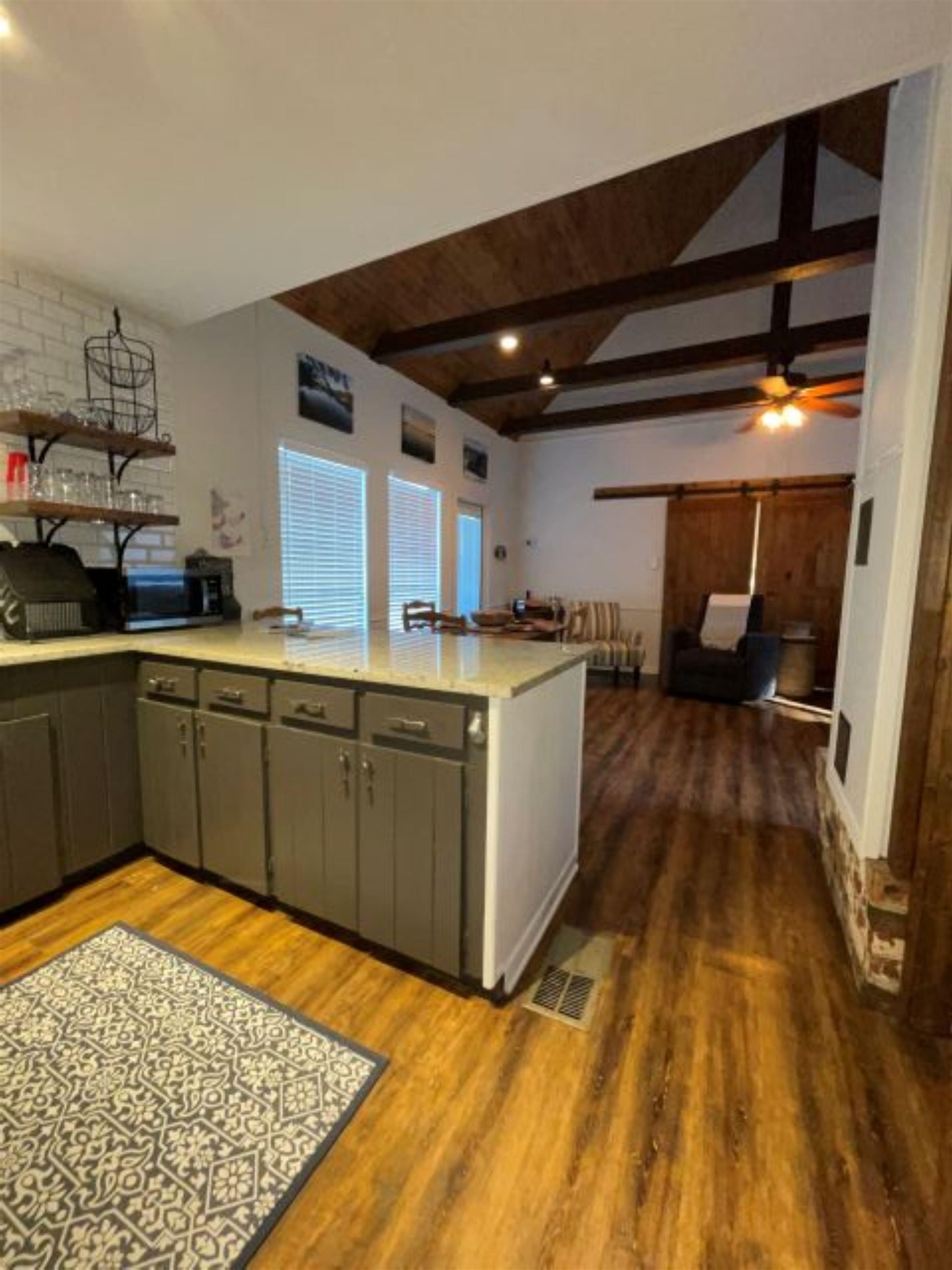 602 Sycamore Road Burnet, TX 78611 - Photo 12 of 26 a kitchen with stainless steel appliances granite countertop a sink stove and refrigerator