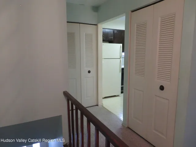 a view of a bathroom from the hallway