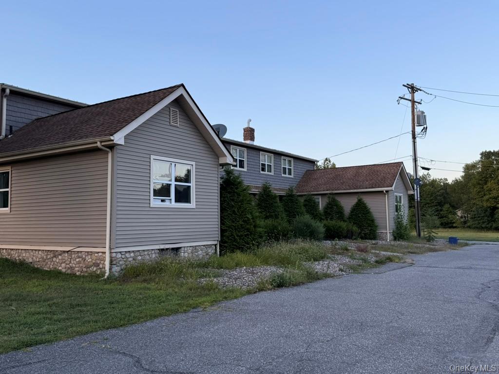 a view of a house next to a yard