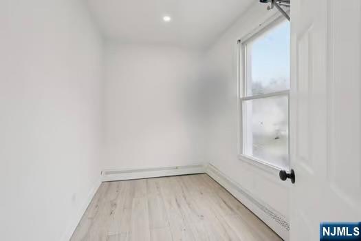 185 James Street, Unit 2 Hackensack, NJ 07601 - Photo 12 of 21 a view of a small space with wooden floor and a window