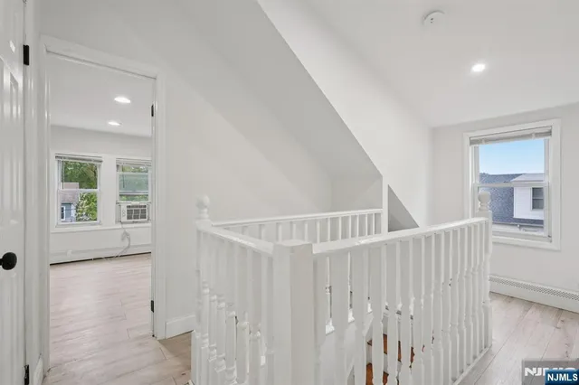 a view of entryway with wooden floor