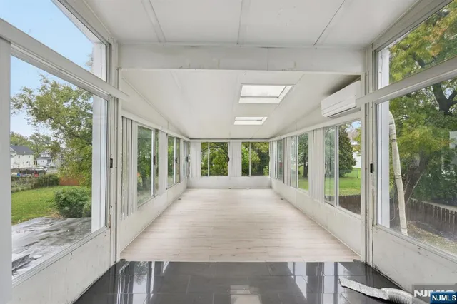a view of a porch with wooden floor and outdoor space