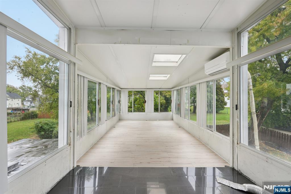 185 James Street, Unit 2 Hackensack, NJ 07601 - Photo 3 of 21 a view of a porch with wooden floor and outdoor space