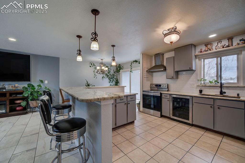 1421 Querida Drive Colorado Springs, CO 80909 - Photo 26 of 49 a kitchen with granite countertop cabinets a sink and a stove