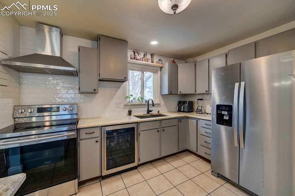 1421 Querida Drive Colorado Springs, CO 80909 - Photo 29 of 49 a kitchen with a sink stainless steel appliances and cabinets