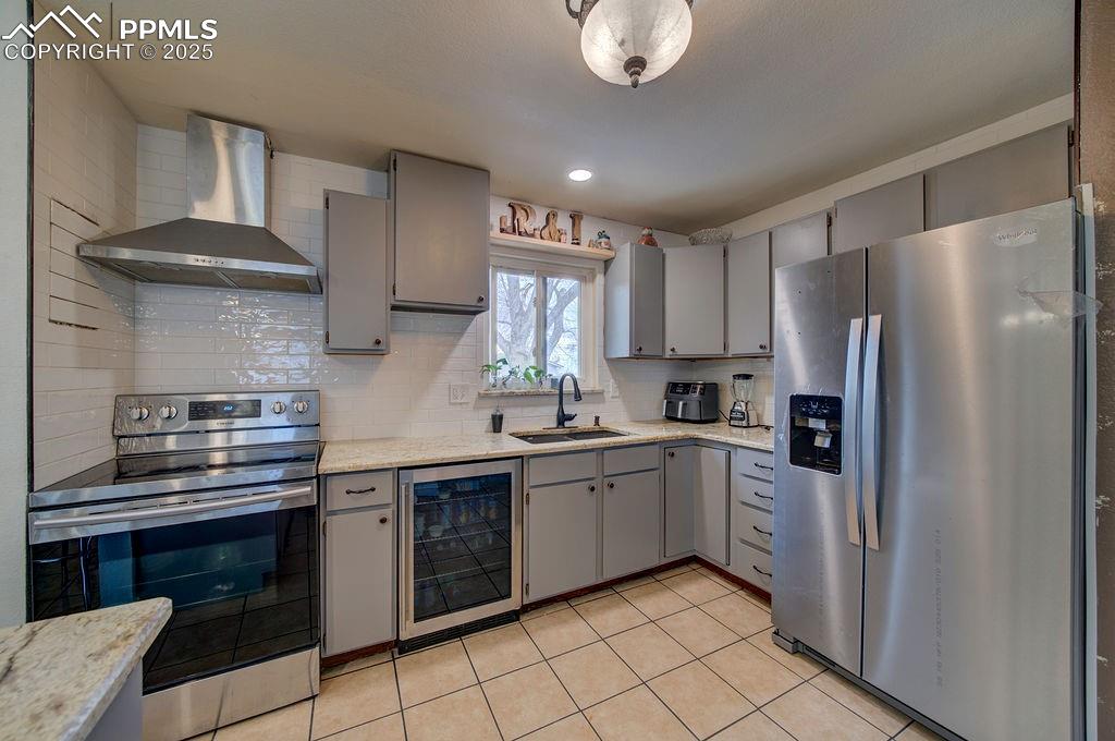 1421 Querida Drive Colorado Springs, CO 80909 - Photo 30 of 49 a kitchen with a sink stainless steel appliances and cabinets