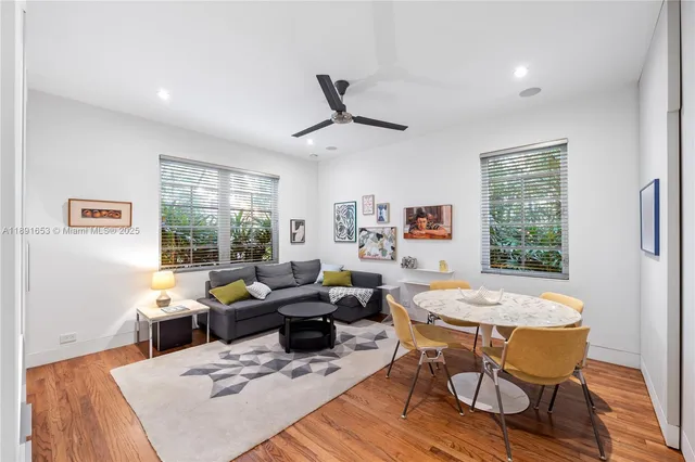 a living room with furniture a window and a table