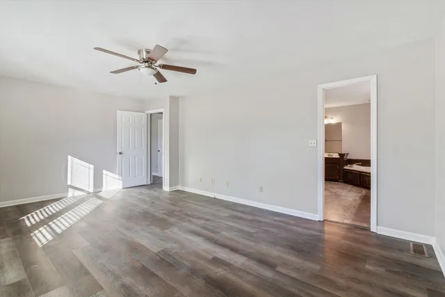 a spacious bathroom with a sink double vanity and a mirror