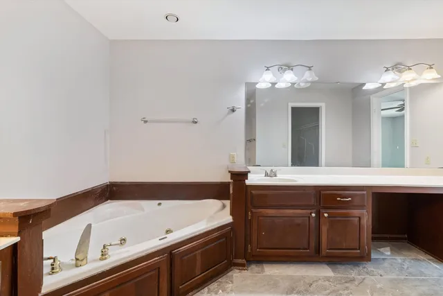 a bathroom with a glass shower door