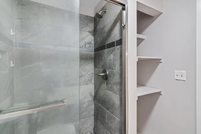 a view of a kitchen with a sink and a refrigerator