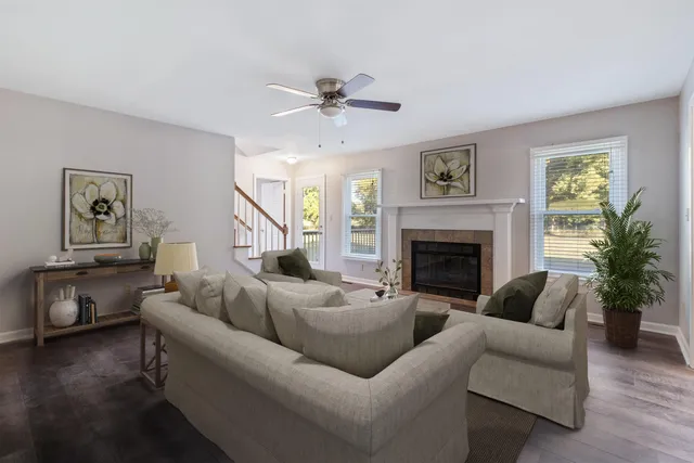 a living room with furniture and a fireplace