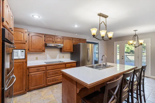 a kitchen with a table and chairs in it
