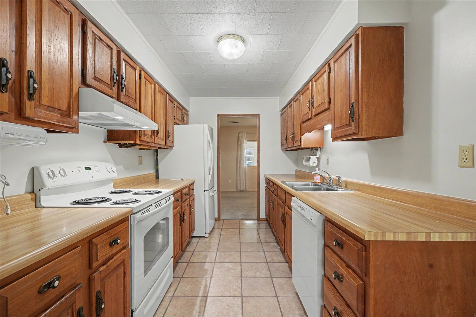 517 Illinois Drive Rantoul, IL 61866 - Photo 13 of 37 a kitchen with stainless steel appliances granite countertop a stove and a sink