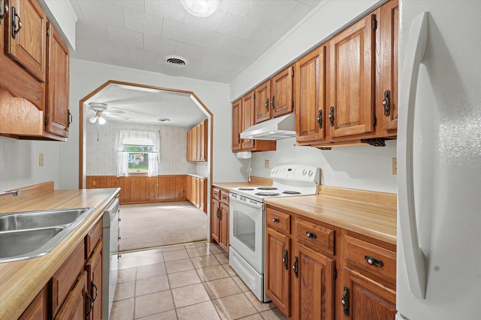 517 Illinois Drive Rantoul, IL 61866 - Photo 15 of 37 a kitchen with a sink stove and cabinets