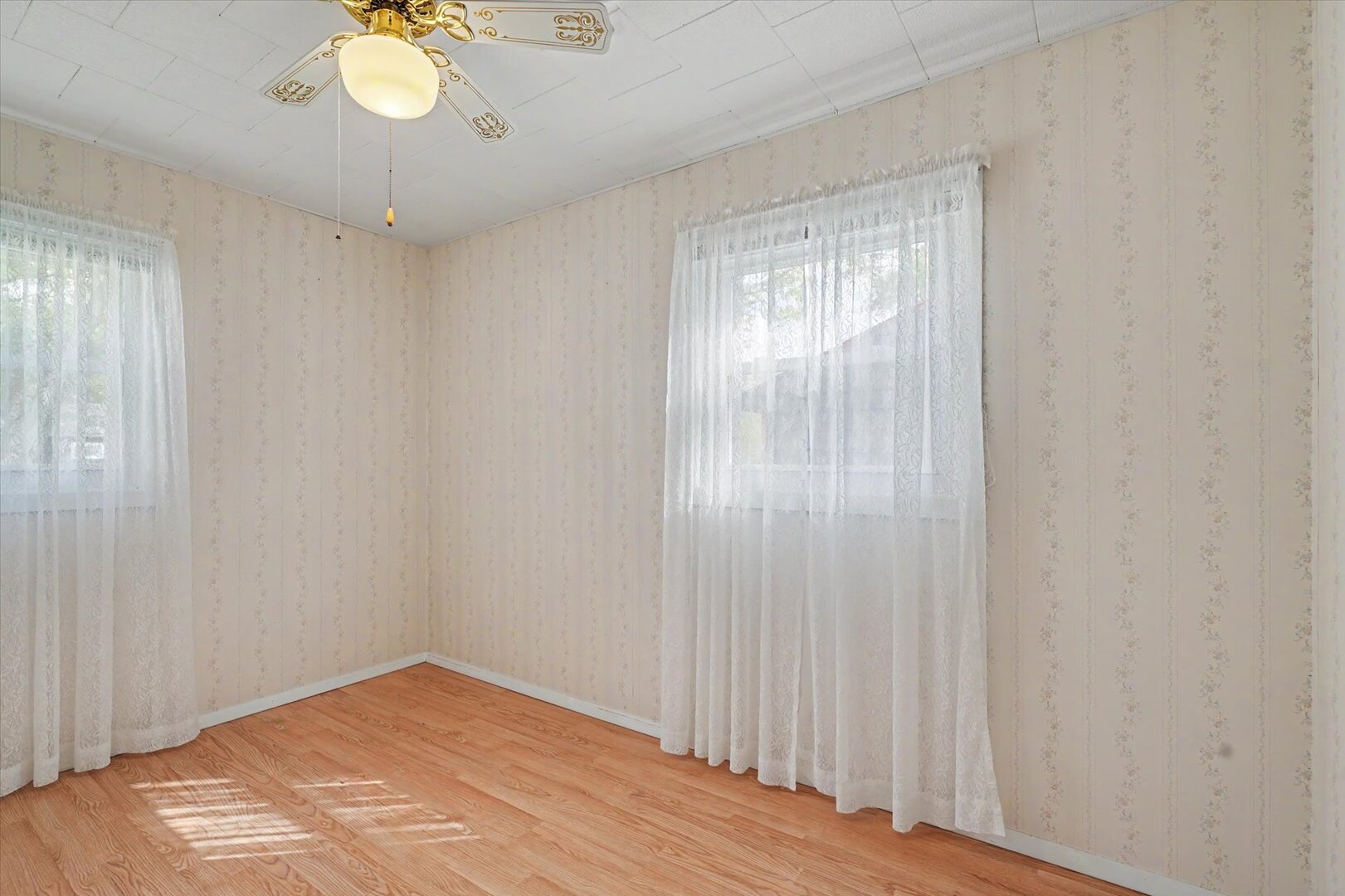 517 Illinois Drive Rantoul, IL 61866 - Photo 21 of 37 a view of an empty room with wooden floor and a window