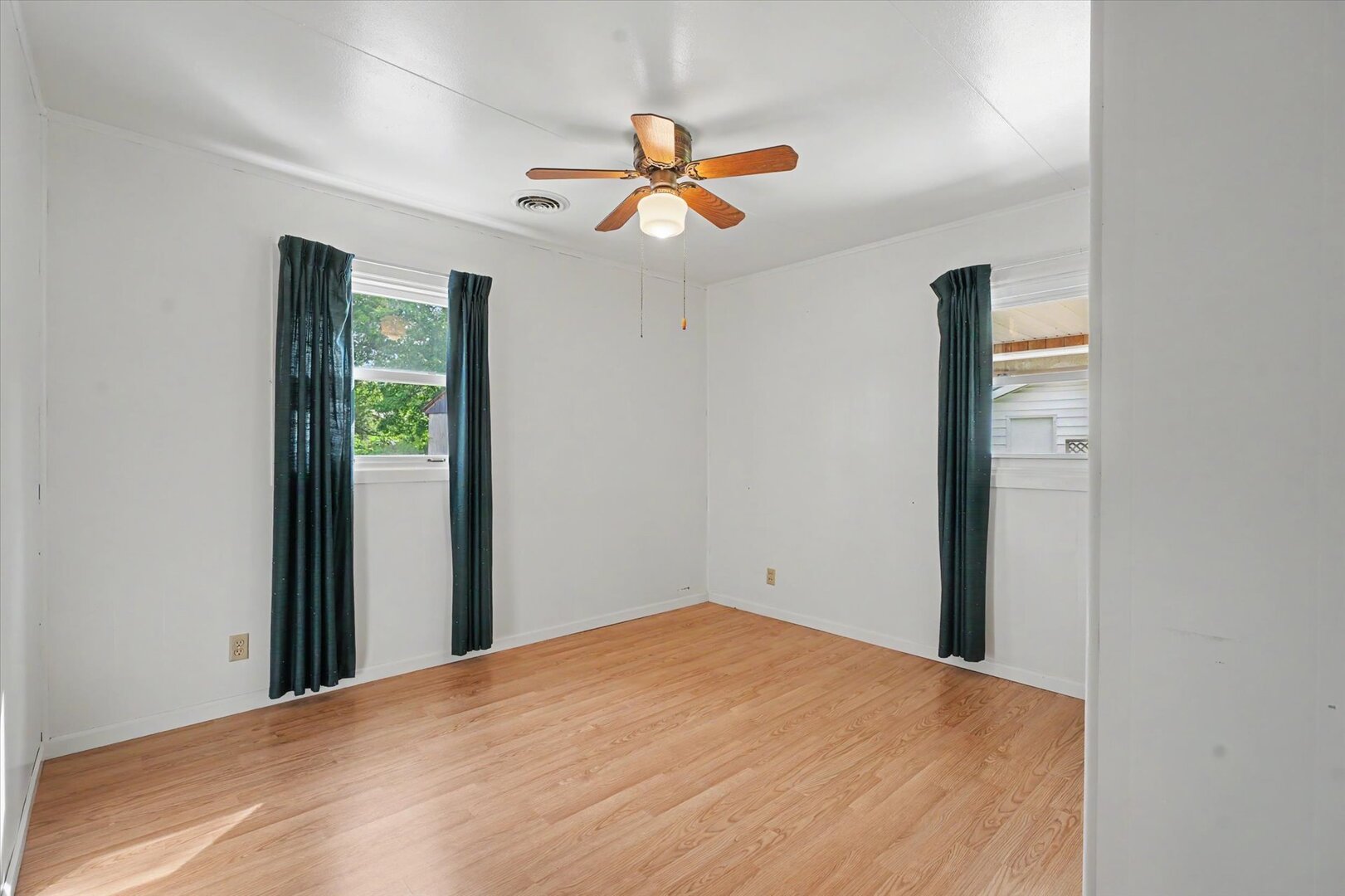 517 Illinois Drive Rantoul, IL 61866 - Photo 23 of 37 a bedroom with a bed and a chandelier