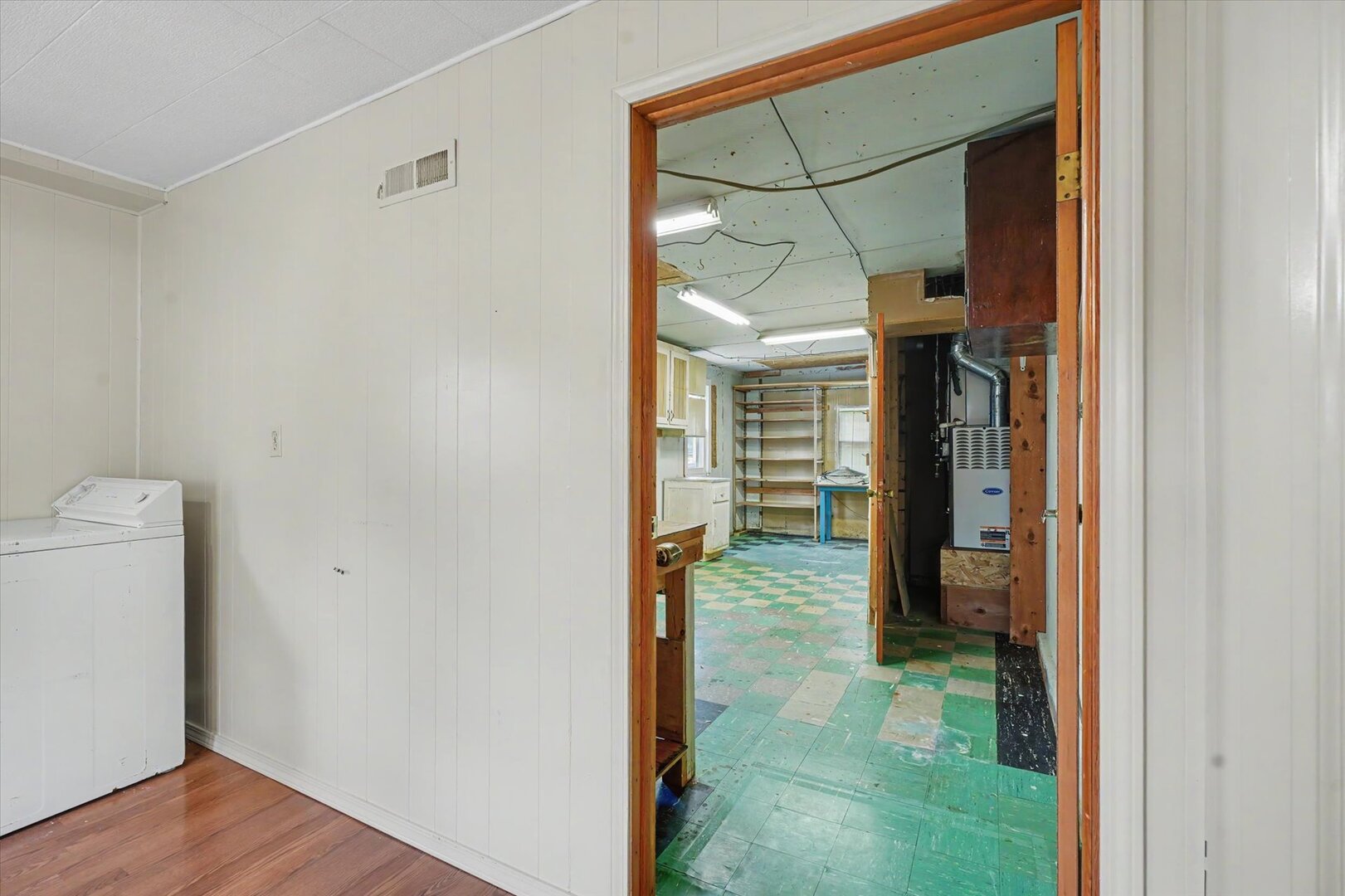 517 Illinois Drive Rantoul, IL 61866 - Photo 27 of 37 a view of a hallway with wooden shelves