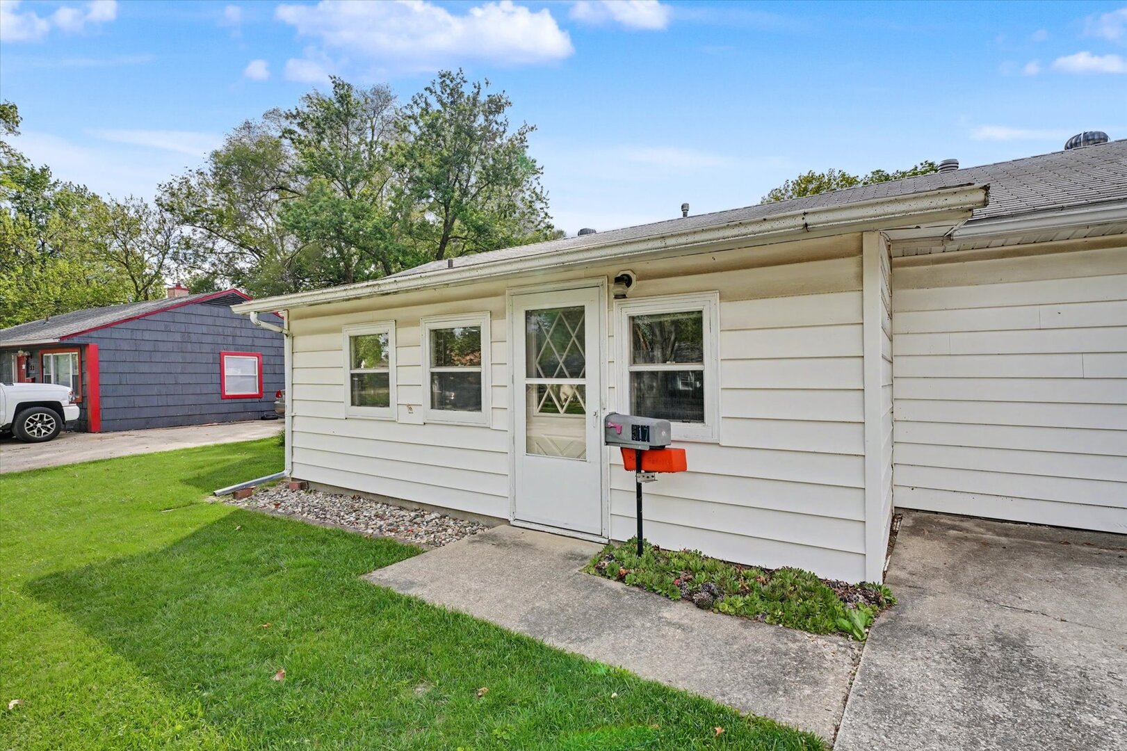 517 Illinois Drive Rantoul, IL 61866 - Photo 5 of 37 a front view of a house with a yard