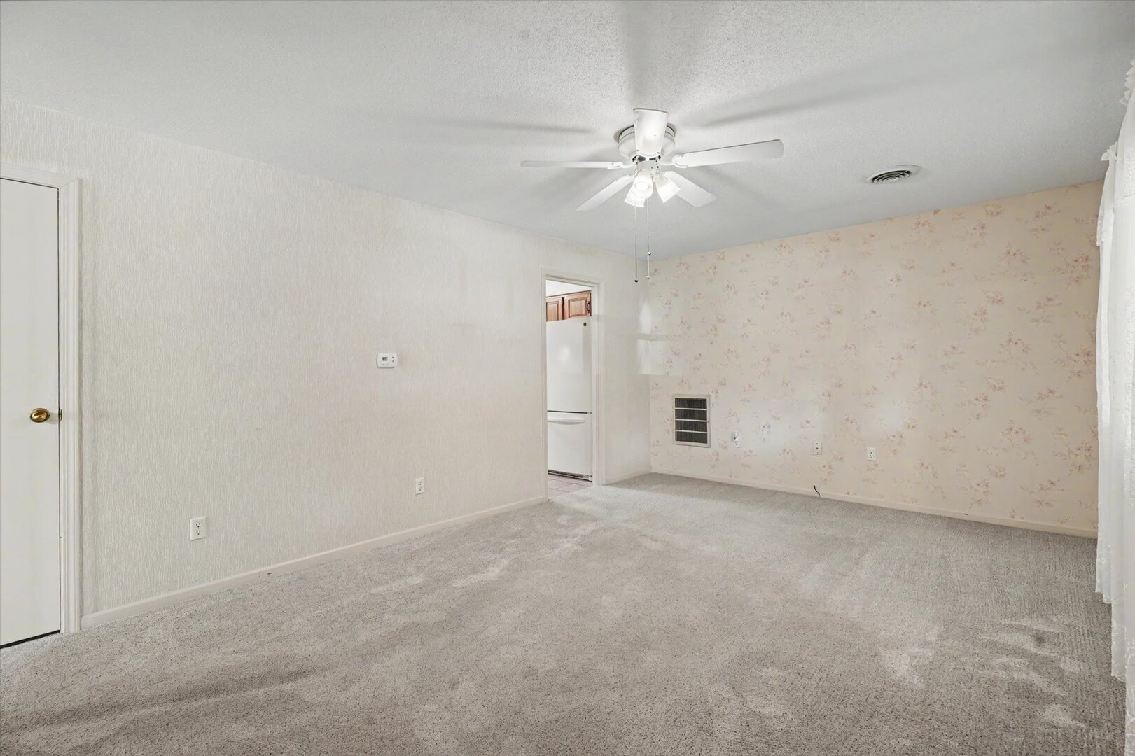 517 Illinois Drive Rantoul, IL 61866 - Photo 9 of 37 an empty room with fan and windows