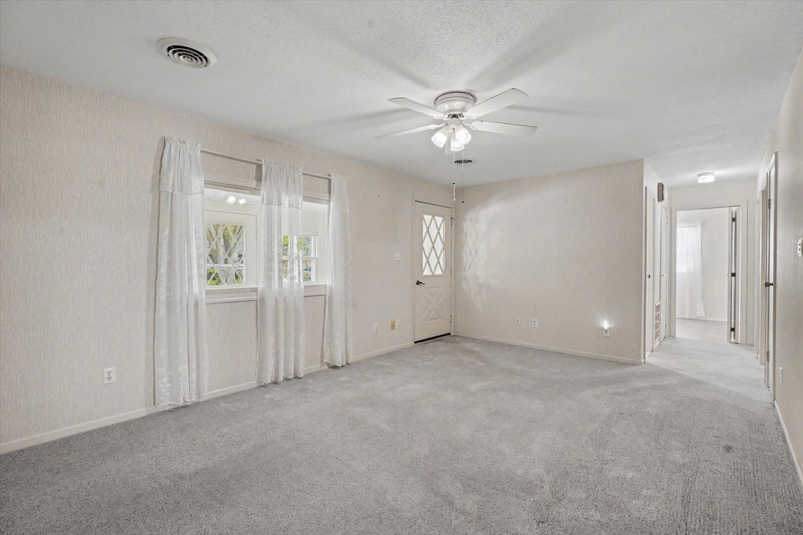 517 Illinois Drive Rantoul, IL 61866 - Photo 10 of 37 an empty room with fan and entrance
