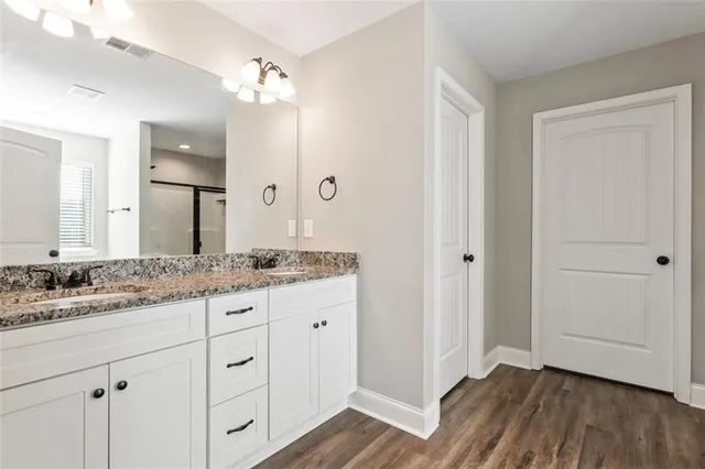 a bathroom with bathtub and a window