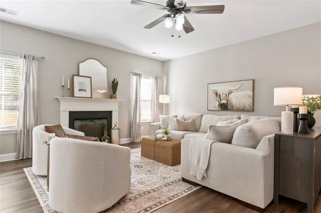 a living room with furniture and a fireplace
