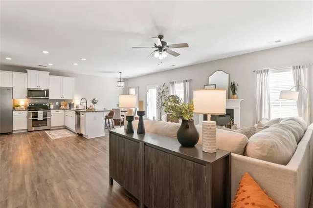 a kitchen with stainless steel appliances a sink cabinets and a refrigerator