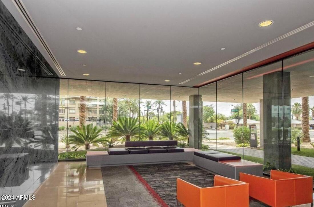 4808 North 24th Street, Unit 902 Phoenix, AZ 85016 - Photo 15 of 17 a living room with furniture and a floor to ceiling window