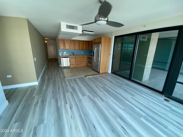 a view of hallway with wooden floor