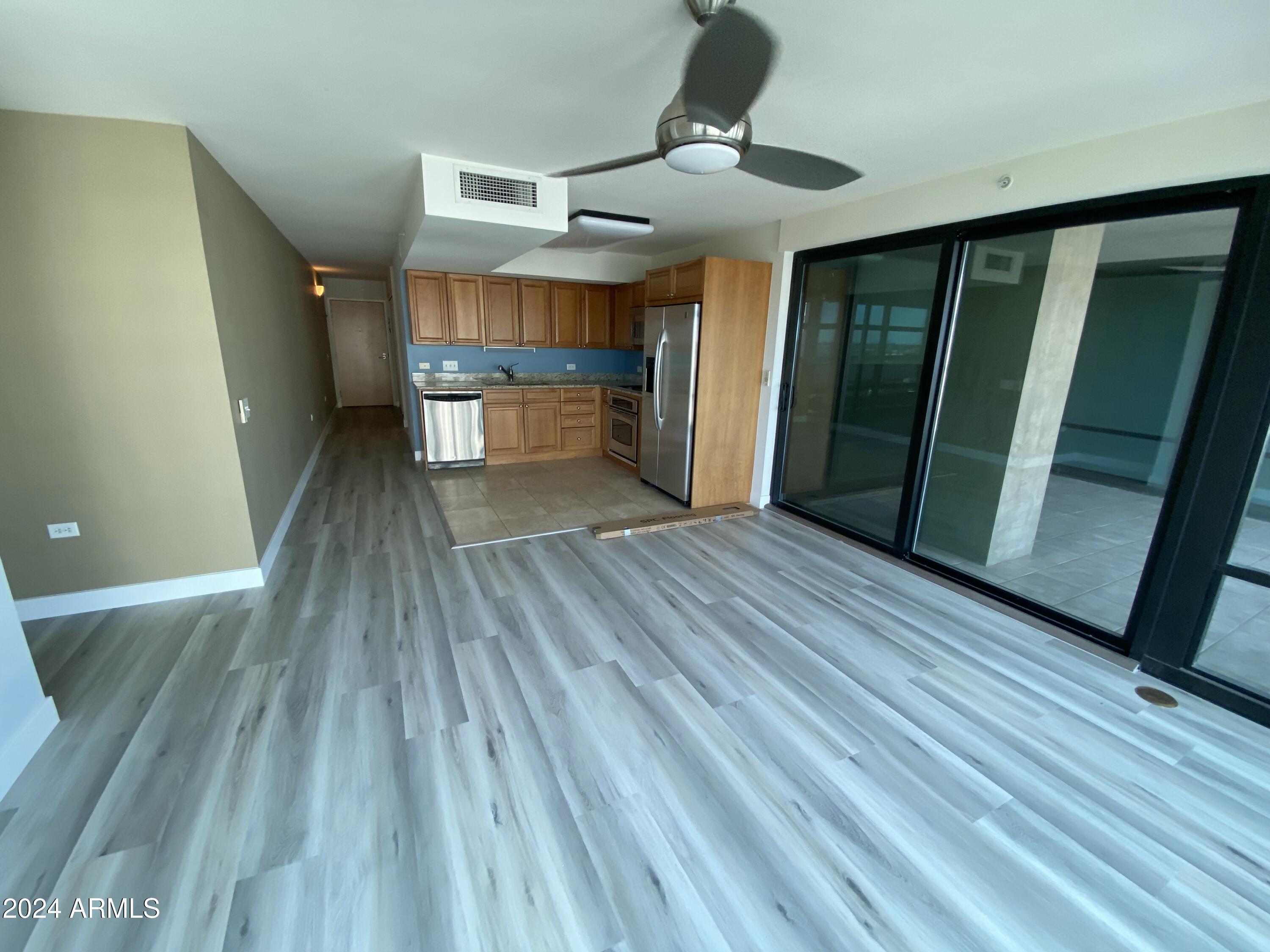 4808 North 24th Street, Unit 902 Phoenix, AZ 85016 - Photo 3 of 17 a view of hallway with wooden floor