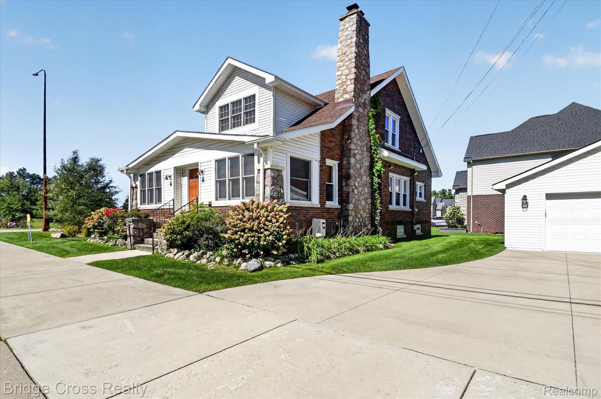 285 East Long Lake Road Troy, MI 48085 - Photo 43 of 49 Two-story exterior with white siding and brick accents