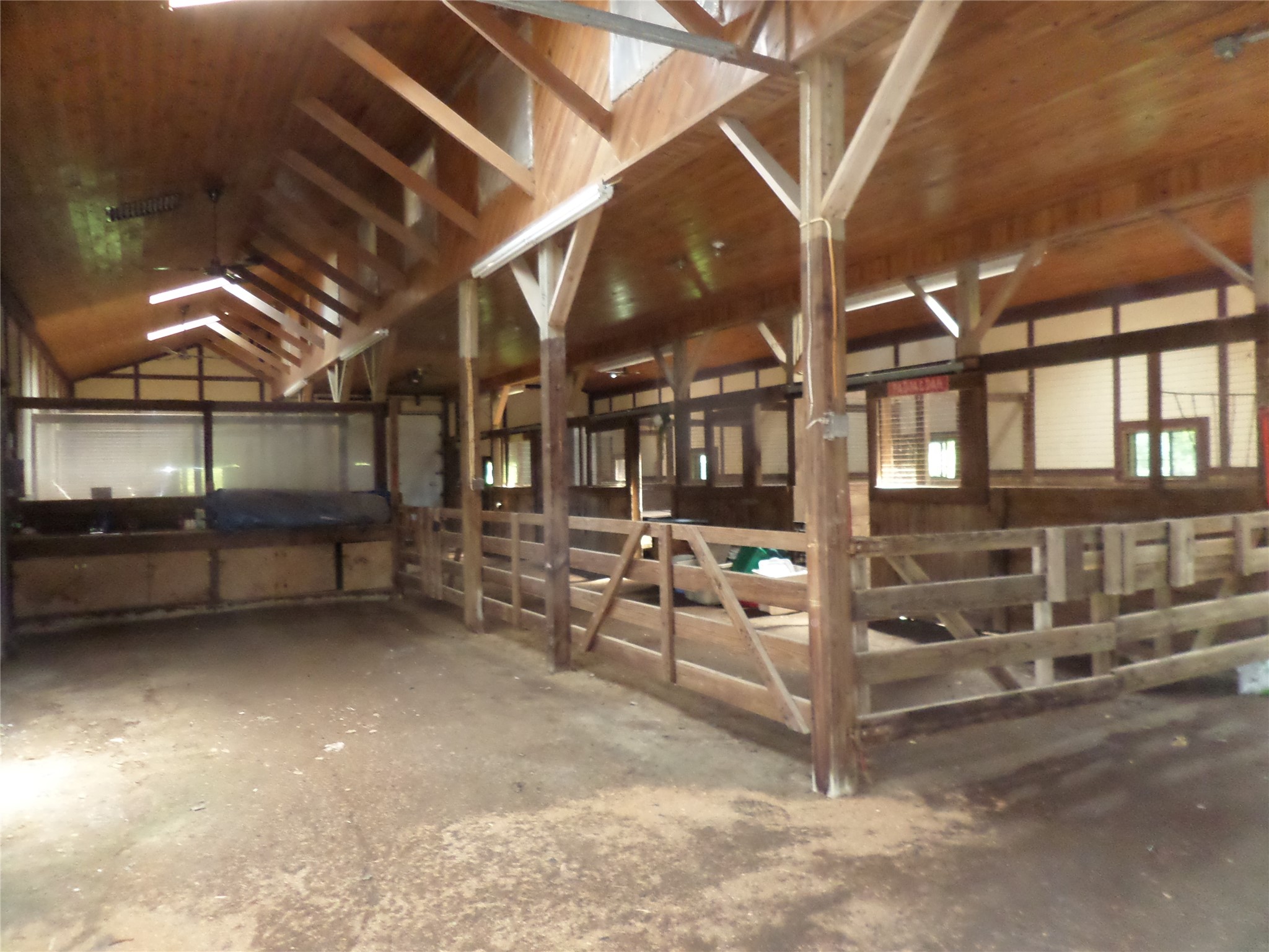 8920 Lake Pleasant Road Erie, PA 16509 - Photo 6 of 19 PLENTY OF LARGE HORSE STALLS AND ROOM FOR TRAINING. VAULTED TONGUE AND GROOVE CEILINGS WITH SKY LIGHTS.