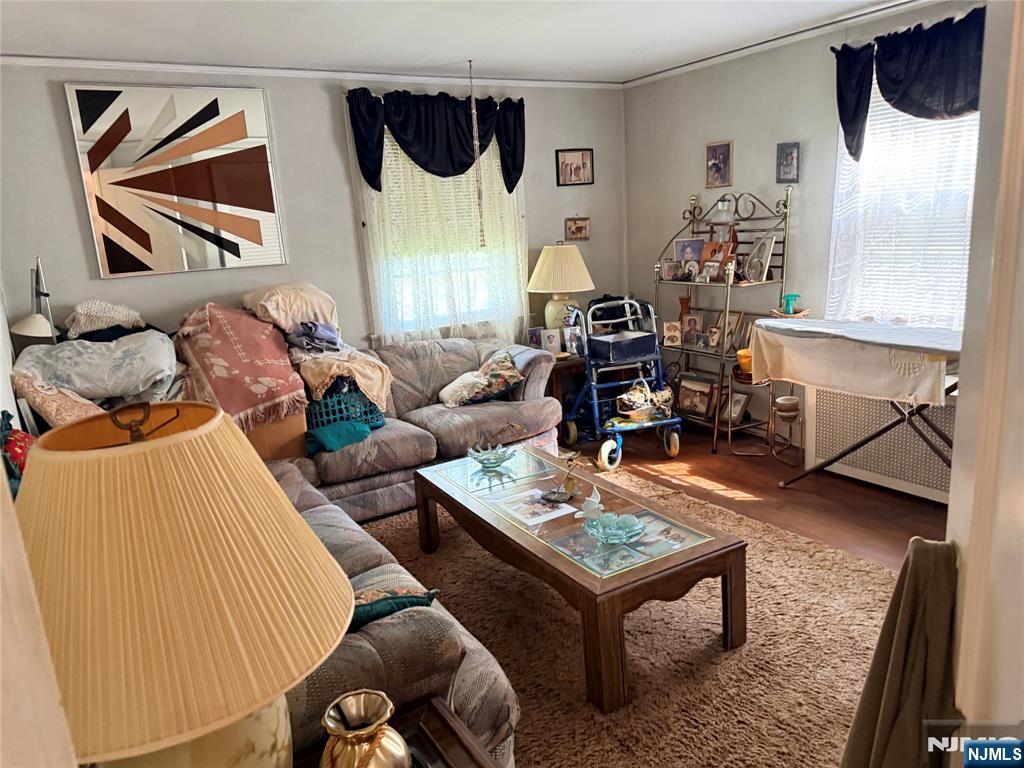 599 South Center Street Orange, NJ 07050 - Photo 11 of 19 a living room with furniture and a painting on the wall