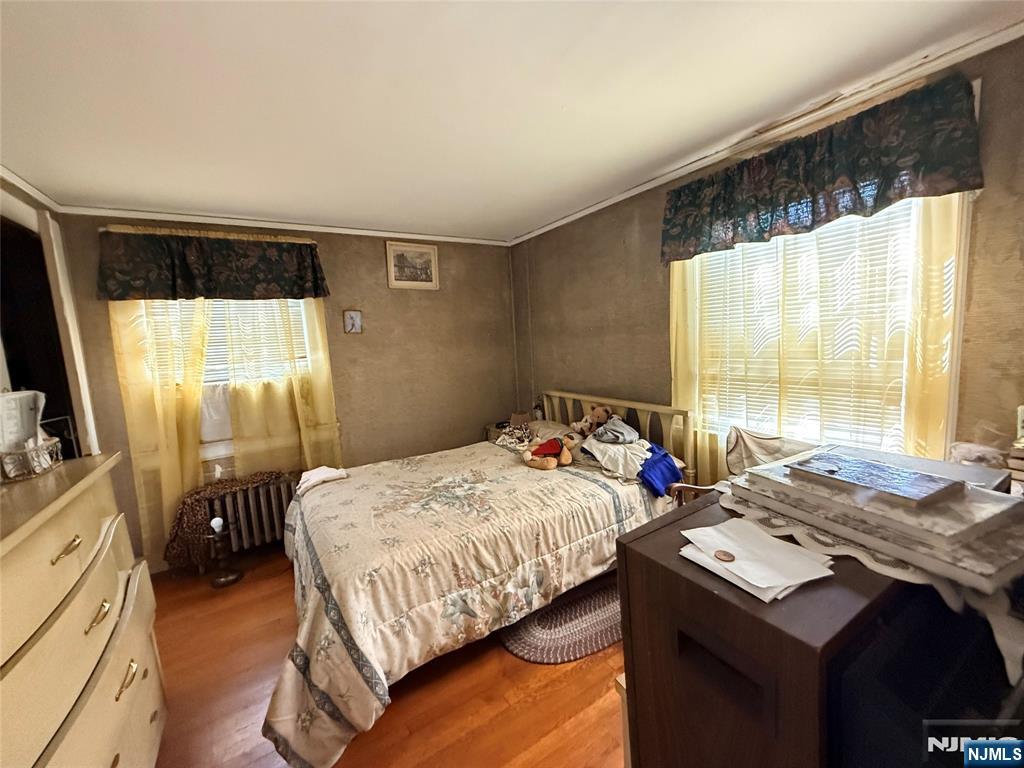 599 South Center Street Orange, NJ 07050 - Photo 12 of 19 a bedroom that has a bed and a table in it