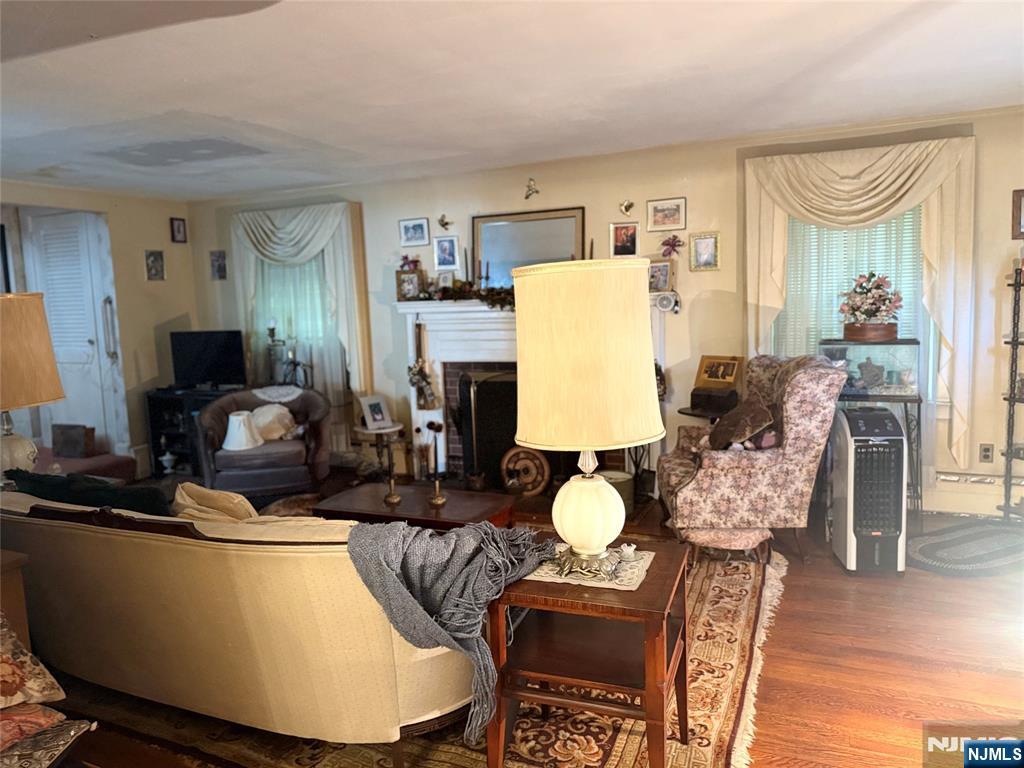 599 South Center Street Orange, NJ 07050 - Photo 2 of 19 a living room with furniture and wooden floor