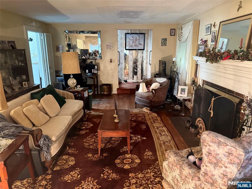 599 South Center Street Orange, NJ 07050 - Photo 3 of 19 a living room with furniture and a fireplace
