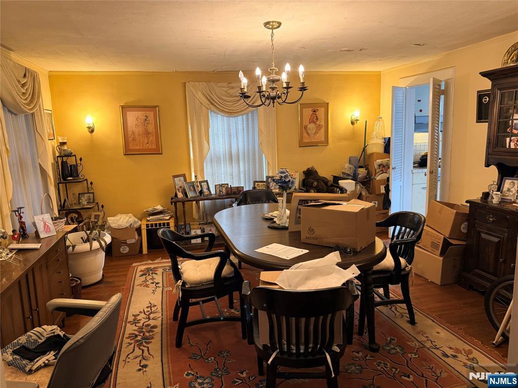599 South Center Street Orange, NJ 07050 - Photo 4 of 19 a view of a dining room with furniture and chandelier