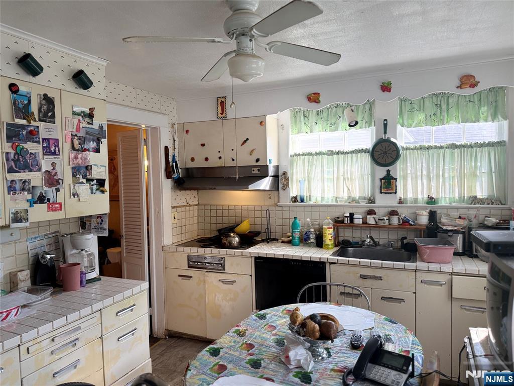 599 South Center Street Orange, NJ 07050 - Photo 6 of 19 a kitchen with a sink stove and cabinets
