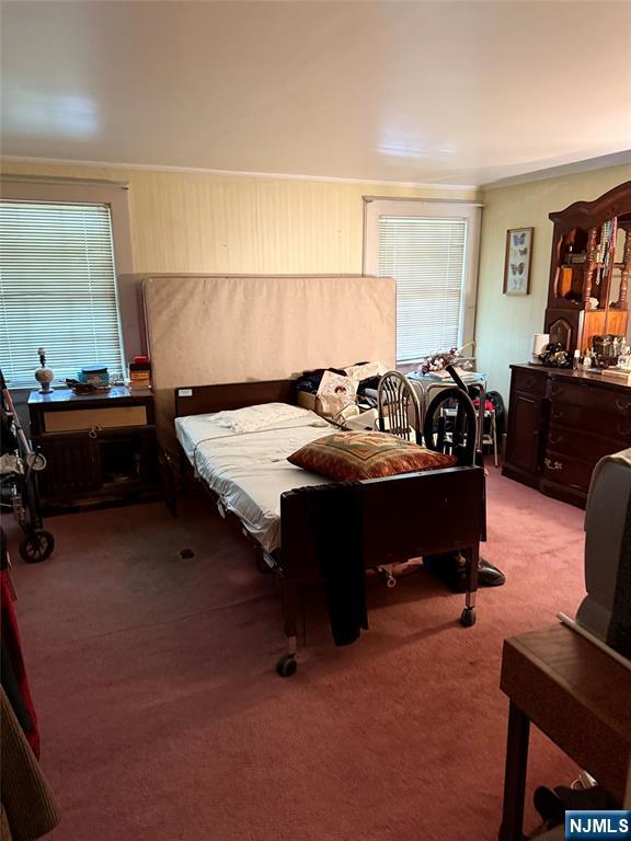 599 South Center Street Orange, NJ 07050 - Photo 7 of 19 a bed room with furniture and a dresser